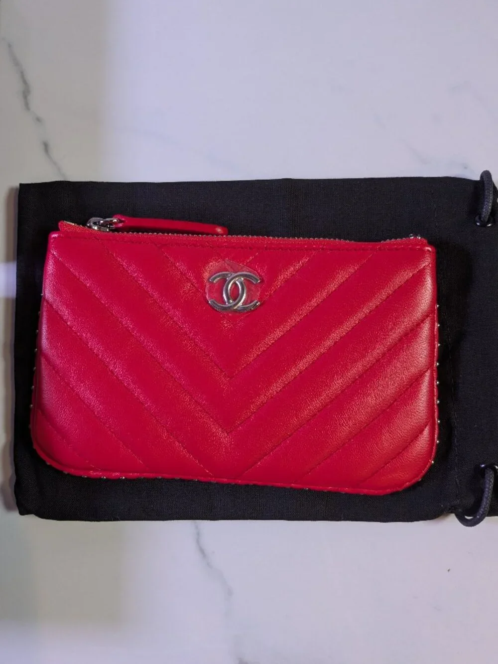 CHANEL Mini O-Case Zip Pouch — Red Chevron Quilted Lambskin, Studded Trim